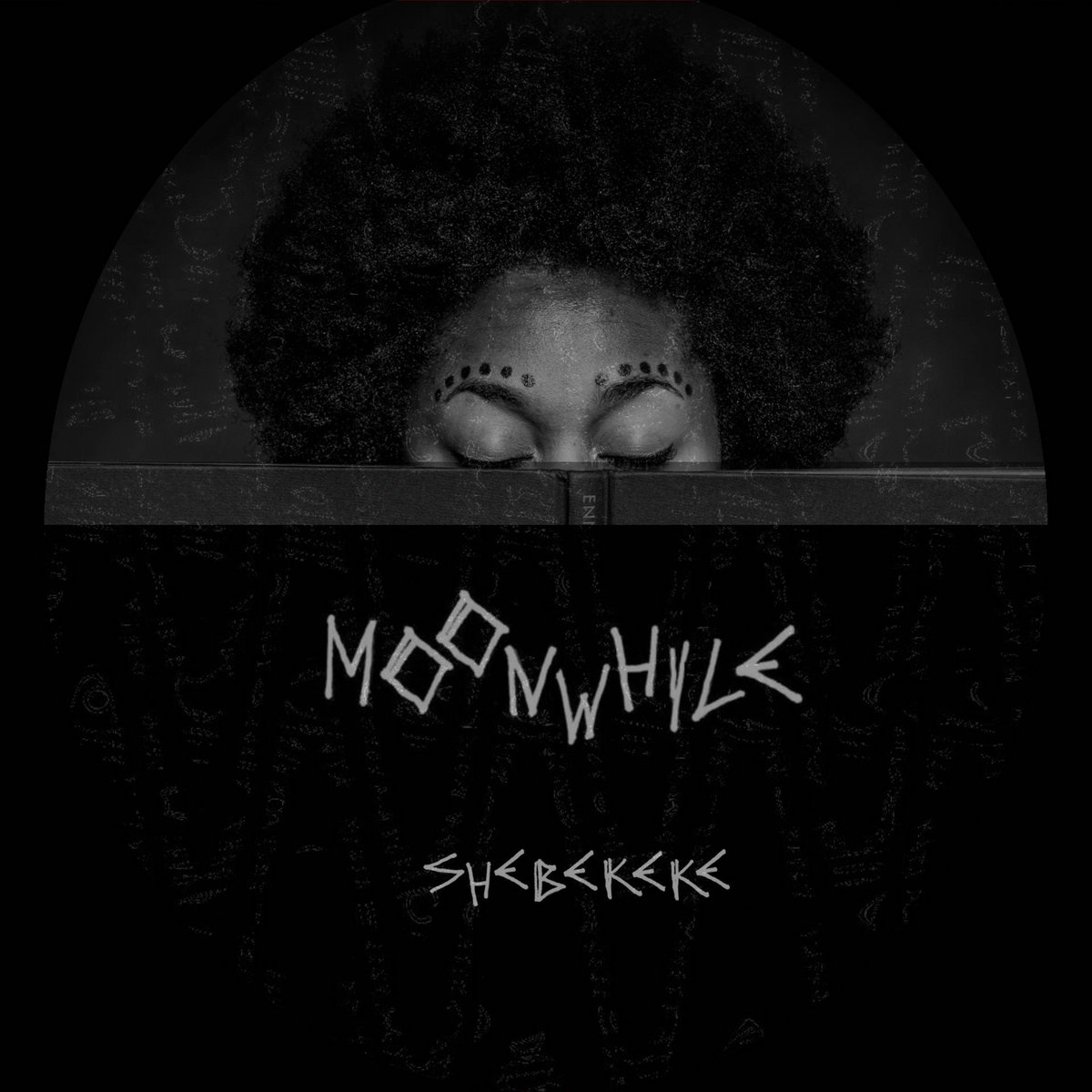 Keisha Thompson's head is inside of a half moon. Her face is covered by a book titled Moonwhile. Her eyes are closed. She has Afro-centric make up decorating her face. Image Credit: Benji Reid