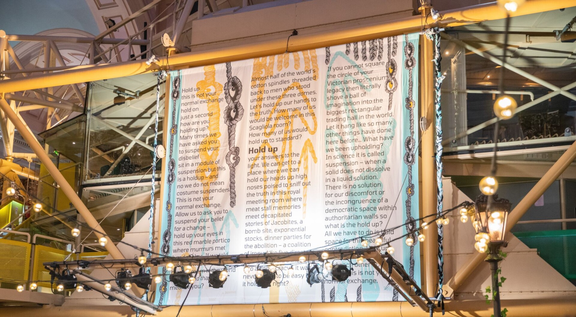 Poem written by Keisha Thompson suspended in the Royal Exchange Theatre